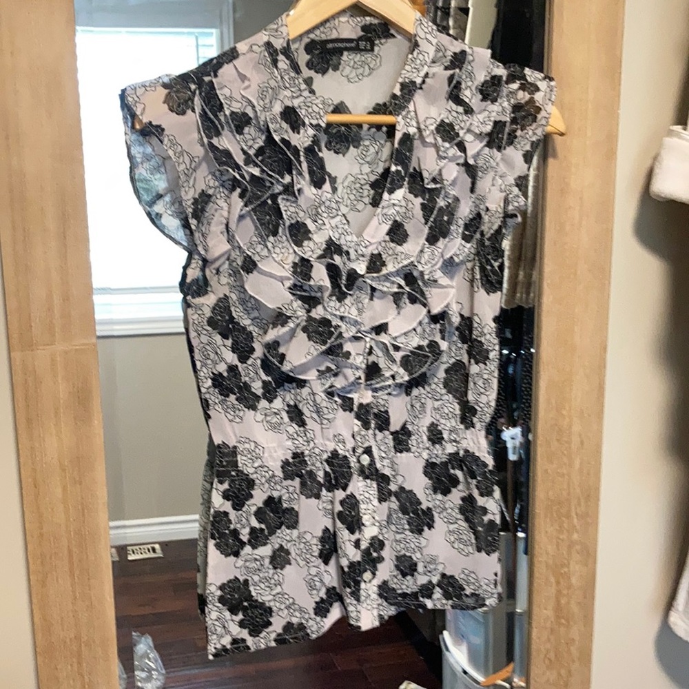 Ruffled sheer blouse.